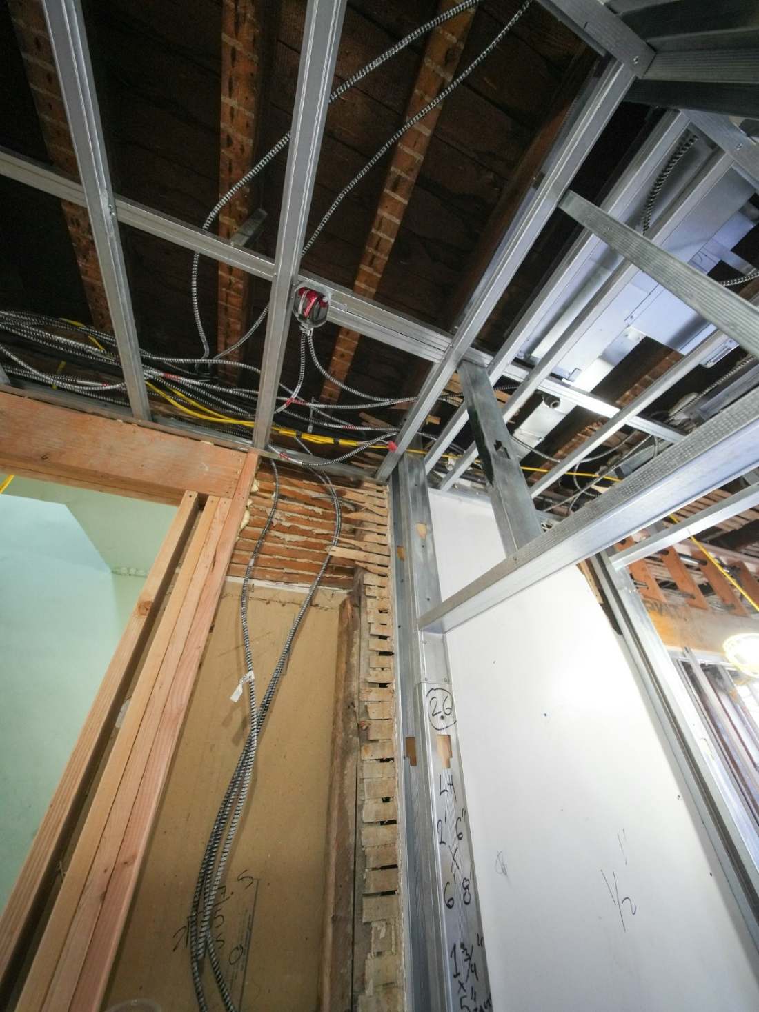 New-construction ceiling framing with wiring runs in place
